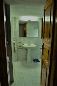 a bathroom with a sink and a mirror at Villa skopelos in Skopelos Town +36 photos