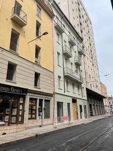 a building on a city street next to a street at IN CENTRO TORINO Charme Appartaments in Turin