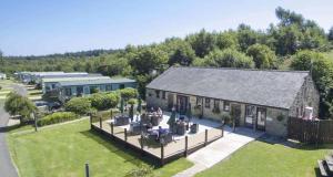 an aerial view of a building with people sitting outside at Slaley Retreat in Slaley