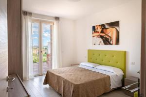 A bed or beds in a room at Sul Calar del Sole al Conero