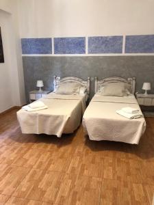 A bed or beds in a room at Hotel Horizonte