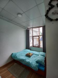 Postel nebo postele na pokoji v ubytování Homestay HoLo