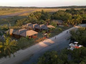 an aerial view of a resort with a river at Inhaca Kanimambo Lodge in Canhamba