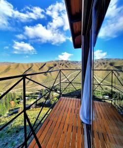 a balcony on a house with a view of the mountains at ArribadelValle - Casas de Altura in Potrerillos