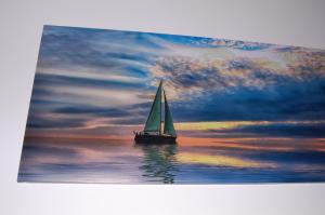 a sail boat in the water with a cloudy sky at B&B Fenix in Trani