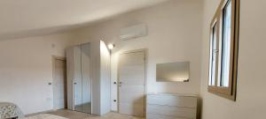 A bed or beds in a room at Appartamento Brigida Bilocale 3 posti vicino al centro