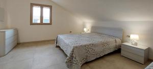 A bed or beds in a room at Appartamento Brigida Bilocale 3 posti vicino al centro