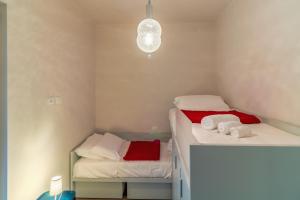 Postel nebo postele na pokoji v ubytování CASA BRIGITTE Comfort, Vista e Parcheggio