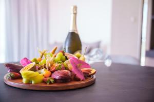 a plate of vegetables on a wooden table at Pavlo Napa Beach Hotel in Ayia Napa
