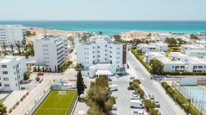 an aerial view of a city with buildings and the ocean at Pavlo Napa Beach Hotel in Ayia Napa
