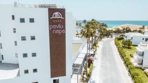 a view of the beach from the balcony of a building at Pavlo Napa Beach Hotel in Ayia Napa