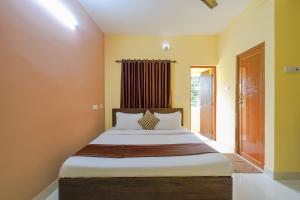 Postel nebo postele na pokoji v ubytování Eco Corporate Inn