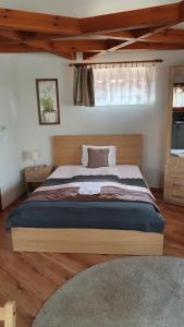 Posteľ alebo postele v izbe v ubytovaní Danubia Apartman