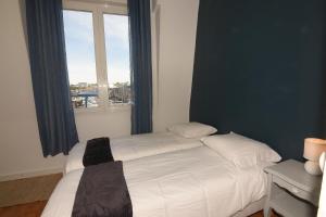Krevet ili kreveti u jedinici u okviru objekta L'Ango appartement triplex vue port