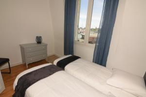 Krevet ili kreveti u jedinici u okviru objekta L'Ango appartement triplex vue port