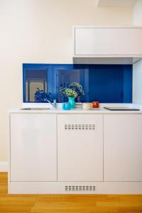 Kuchyň nebo kuchyňský kout v ubytování Orbi City Hotel Official