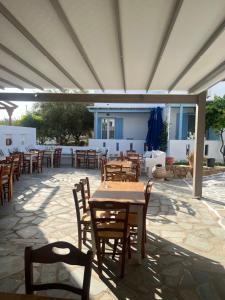 a group of tables and chairs on a patio at Argo in Antiparos