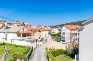a view of a street in a town with houses at Apartments Luka in Supetarska Draga
