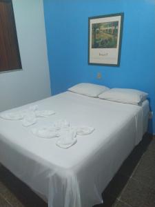 Uma cama ou camas num quarto em Hotel Lagoa Azul