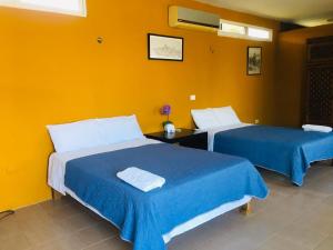 Postel nebo postele na pokoji v ubytování Casa Hacienda San Gabriel + 37 fotografií
