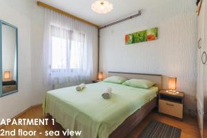 Postel nebo postele na pokoji v ubytování Beautiful Sea View Apartments - Niko Čeko