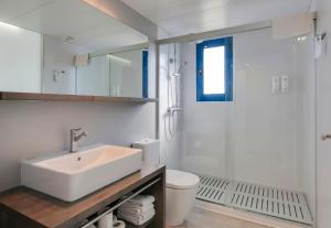 a bathroom with a sink and a toilet and a shower at Cambrils Park Family Resort in Cambrils