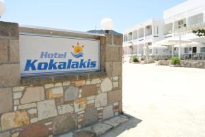 a sign for a hotel kokoolis on the side of a building at Kokalakis Hotel in Kefalos
