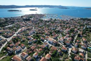 an aerial view of a city and the water at Apartments and Rooms Sinka in Biograd na Moru