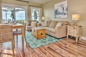 a living room with a couch and a table at Bungalow Beach Place 1 in Clearwater Beach