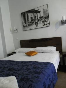 Postel nebo postele na pokoji v ubytování Hôtel Central