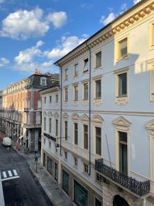 a row of buildings on a city street at IN CENTRO TORINO Charme Appartaments in Turin