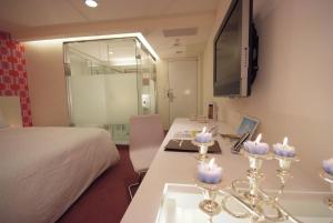 TV a/nebo společenská místnost v ubytování Hotel Purity