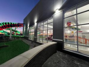 a view of a building with a roller coaster at Crowne Plaza - Kearney, an IHG Hotel in Kearney