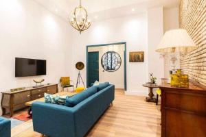 TV a/nebo společenská místnost v ubytování MonKeys Apartments Betis Chill Out