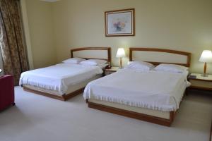 Postel nebo postele na pokoji v ubytování Hotel Sagres