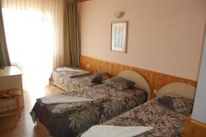 Кровать или кровати в номере Хотел Варненци