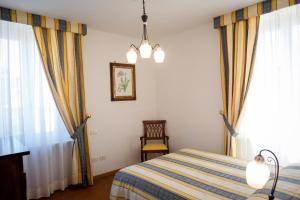 Posteľ alebo postele v izbe v ubytovaní Dimora Palazzo La Fenice