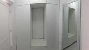 a bathroom with a mirror and a white cabinet at New Apartment Apartament modern recent construit Modern újépítésű társasházi lakrész in Miercurea-Ciuc