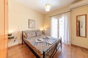 Posteľ alebo postele v izbe v ubytovaní Helen Corfu House