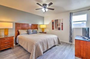 a bedroom with a bed and a ceiling fan at Odessa Apartment Near Parks, Shops and Dining! in Odessa