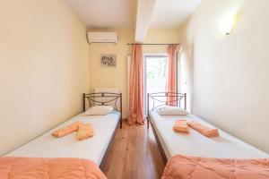 Posteľ alebo postele v izbe v ubytovaní Helen Corfu House