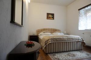 Postel nebo postele na pokoji v ubytování Hotel Claudiu