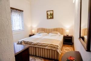Postel nebo postele na pokoji v ubytování Hotel Claudiu