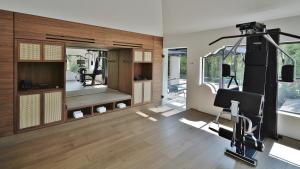 a room with a gym with a treadmill and a mirror at Casa Polanco Hotel Boutique in Mexico City