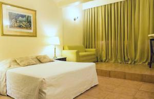 Dayrell Hotel e Centro de Convenções客房内的一张或多张床位
