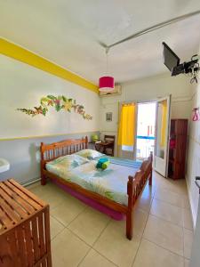 Postel nebo postele na pokoji v ubytování Hotel De la Plage