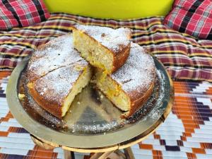 two slices of cake on a plate on a table at Le Jardin . (The garden) in Almora