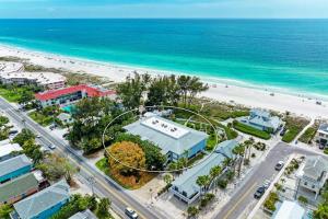 an aerial view of a resort near the beach at Sunset Beach 102: Gulf Front, Stunning Views, On the Beach, Pool by Anna Maria Life Vacation Rentals in Holmes Beach