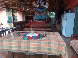 a table with a table cloth on it in a room at Bistrô Pousada Savacipó in Serra do Cipo