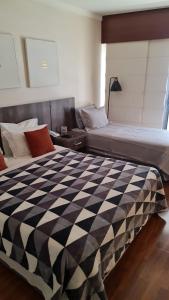 Llit o llits en una habitació de Hotel Grand Plaza Paulista